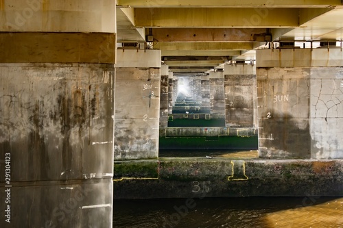 Under the bridge.