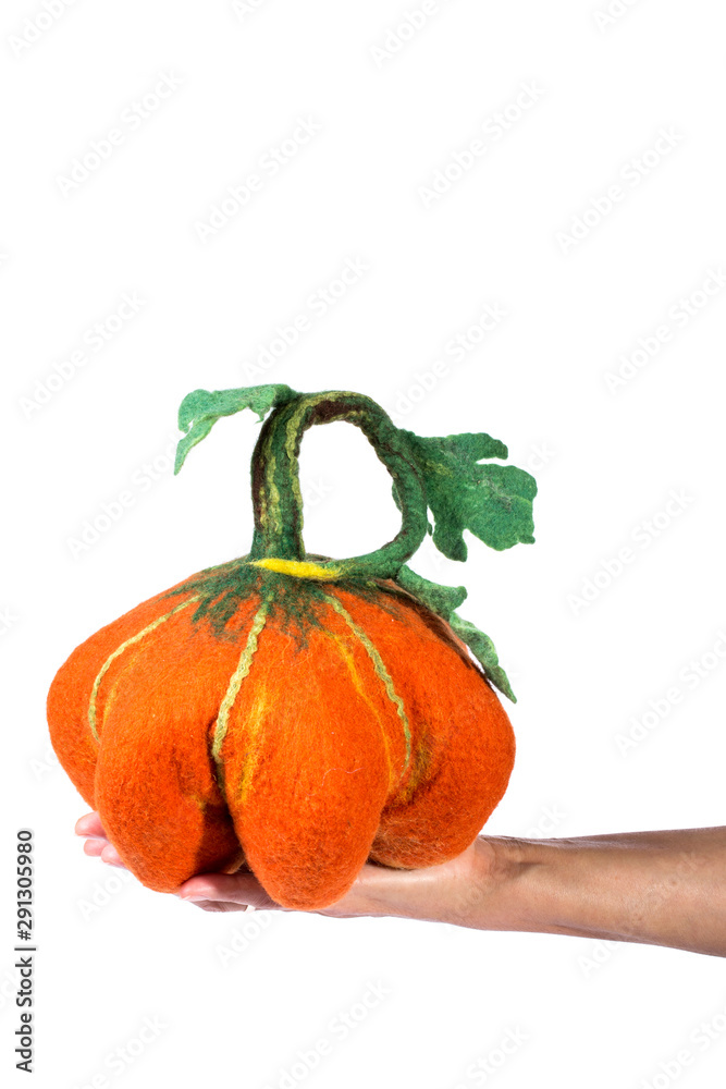 Obraz premium Pumpkin handmade from felted wool for celebration of Halloween