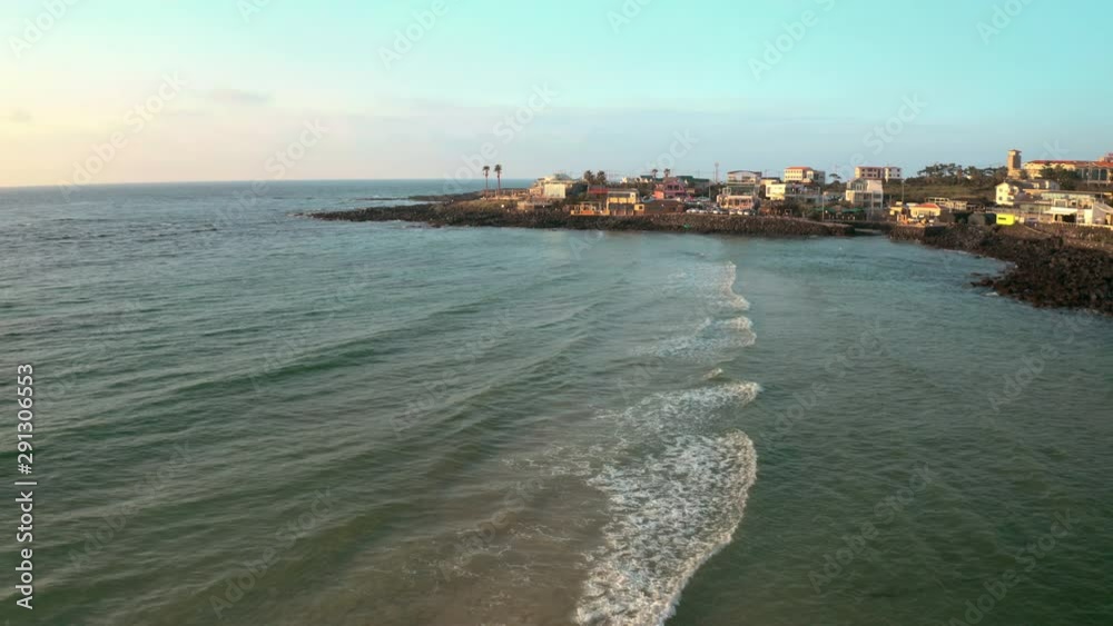 Drones flying across the ocean towards the beach. Jeju Island, South Korea Drones flying across the ocean towards the beach. Jeju Island, South Korea