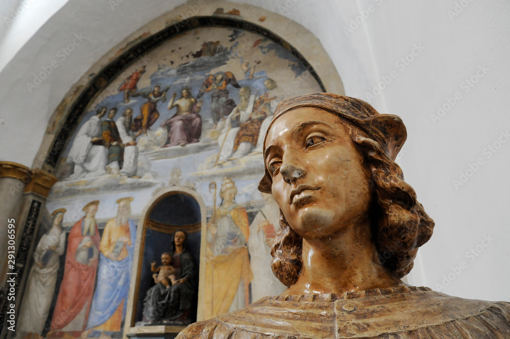 Bust of Raffaello Sanzio, known as Raphael. On the background there is a fresco painted by Raffaello Sanzio. Chapel of San Severo, Perugia, Italy