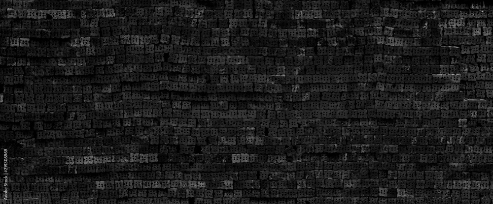 Black brick wall texture for background.