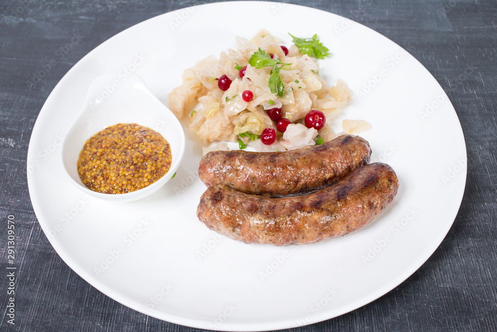 Grilled sausages with sauerkraut.