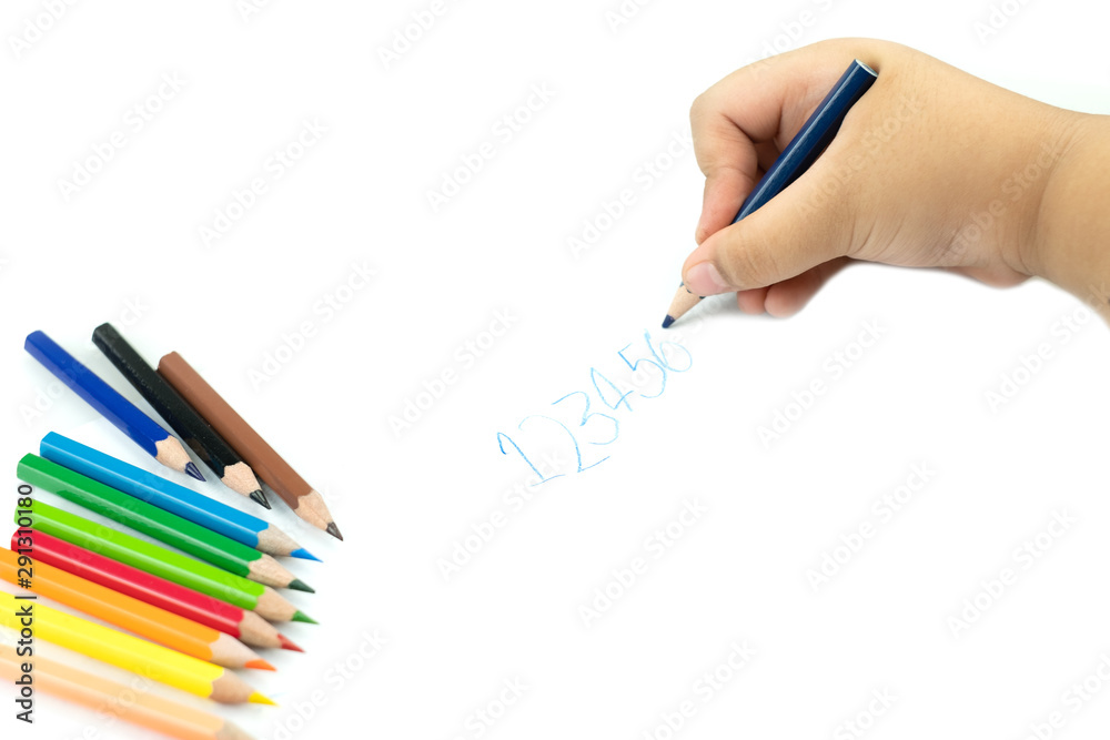Close up of girl hand with pencil writing english words by hand on  white notepad paper at white background