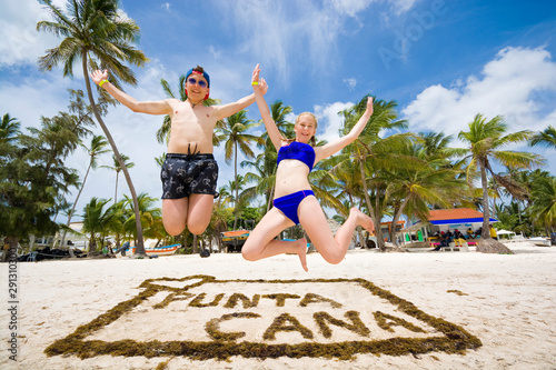 Happy teenagers jumping ove...