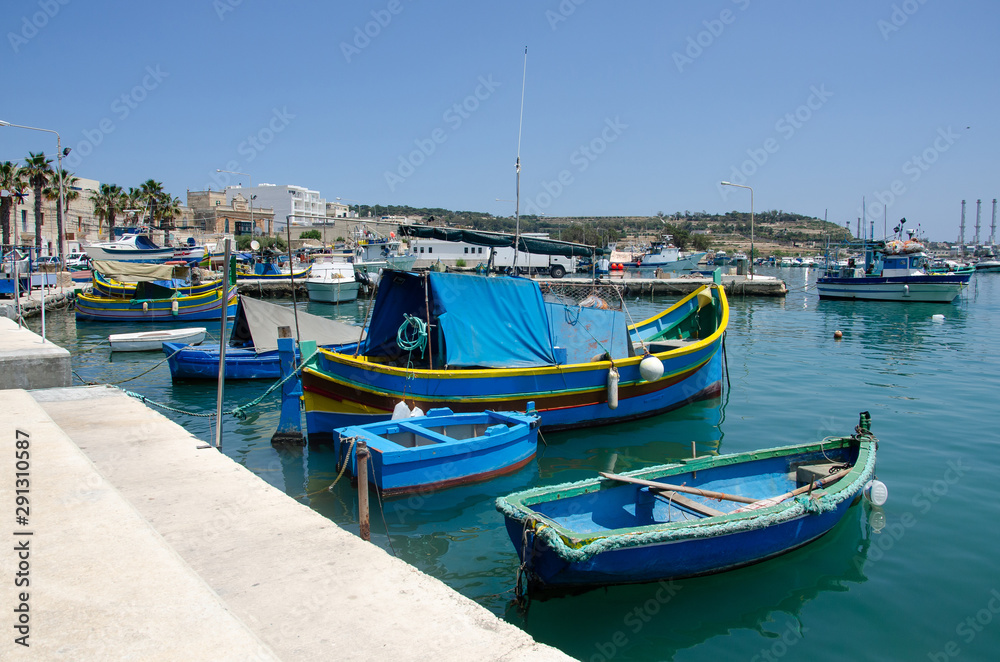 Harbour of Marsaxlokk village in Malta with colourful fishing boats