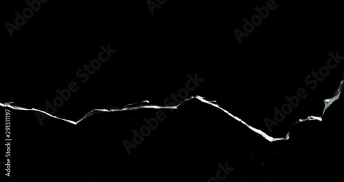 Shattered and broken glass shards flying through the air after crush broken window on a black background