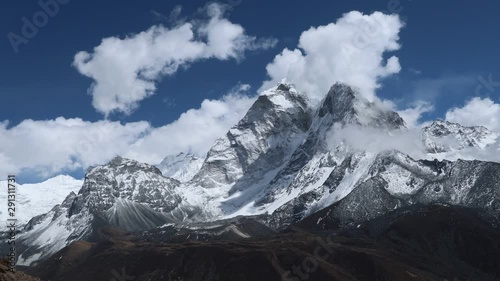 Majestic mountain motion time lapse close up of clouds running around Ama Dablam