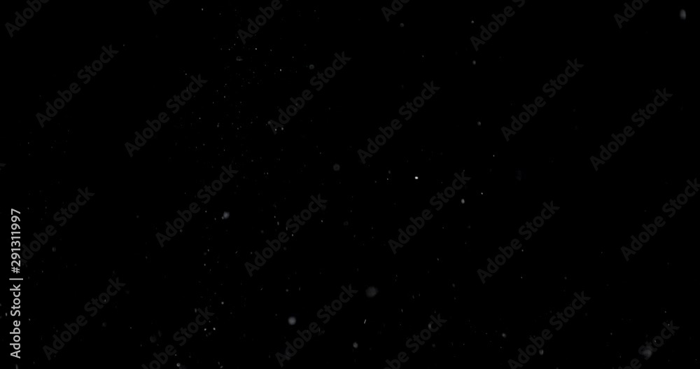 Shattered and broken glass shards flying through the air after crush broken window on a black background