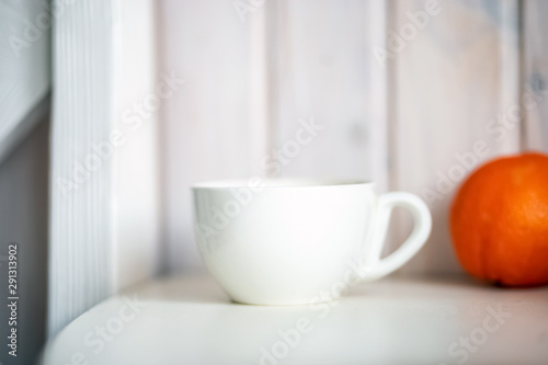 Blank white mug on kitchen table.