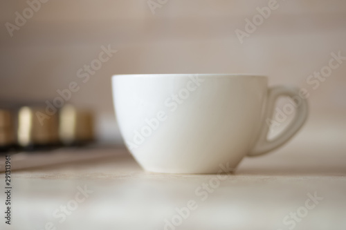 Blank white mug on kitchen work surface.