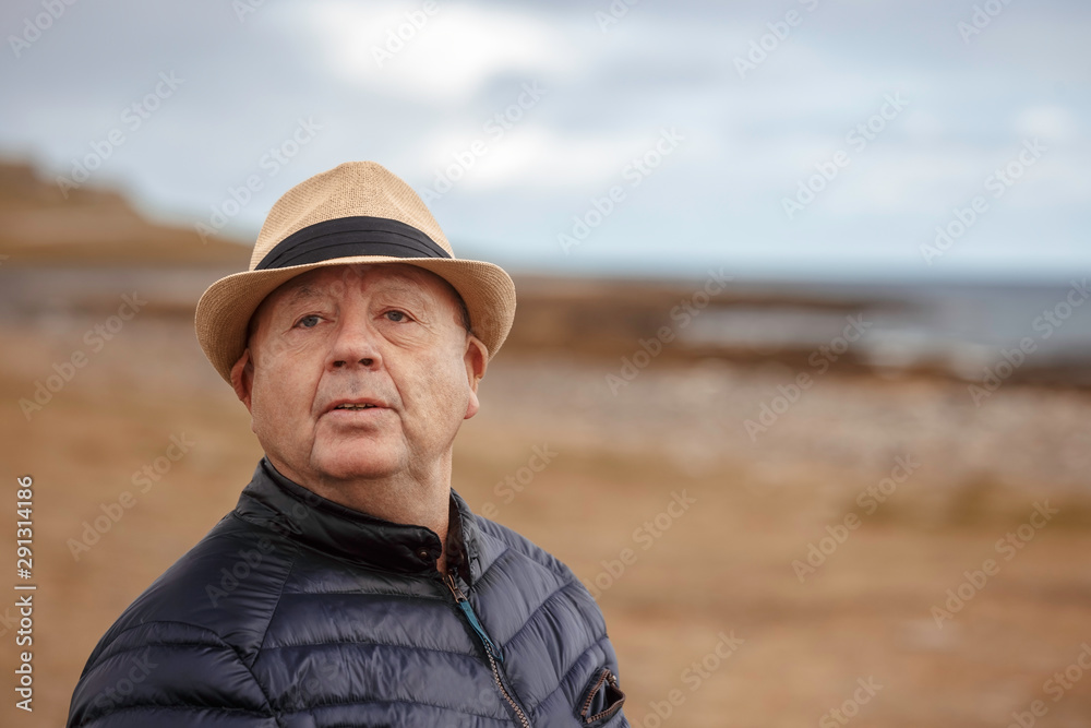 Senior man looking what happens staying alone by the sea