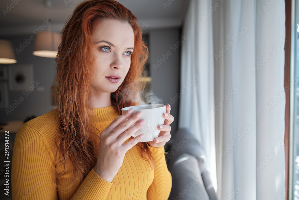 woman near window.Dream and relax woman near window.Dream and relax