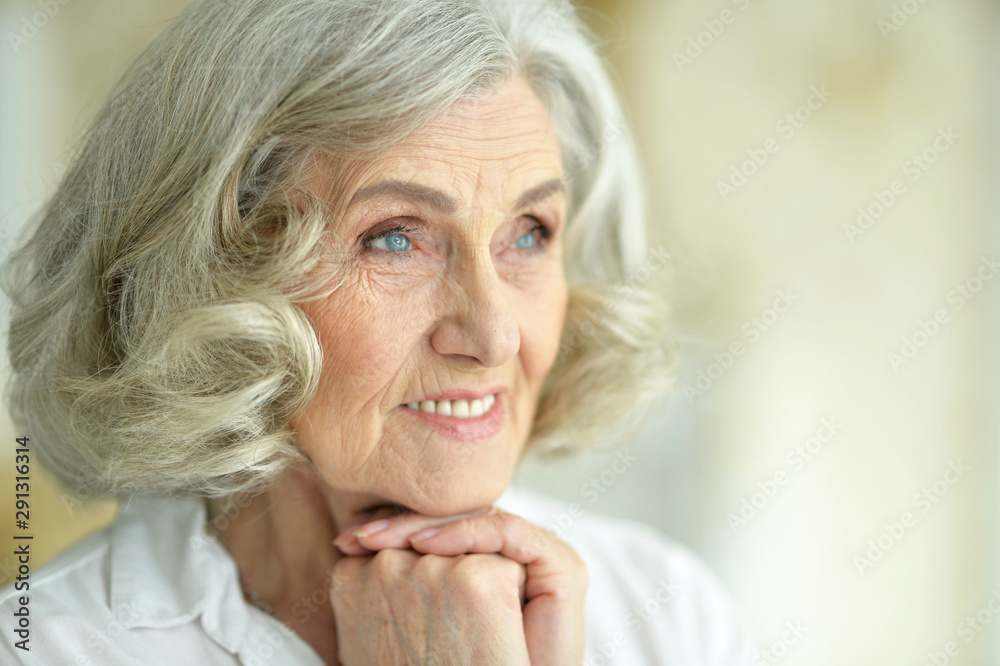 Beautiful smiling senior woman posing at home Beautiful smiling senior woman posing at home