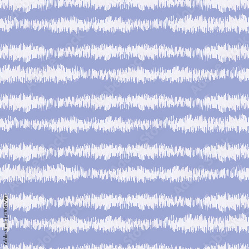 Blurry indigo blue shibori striped tie dye background. Seamless pattern with irregular broken stripe bleached resist. Dip dyed bright batik textile. Variegated textured trendy boho fashion swatch