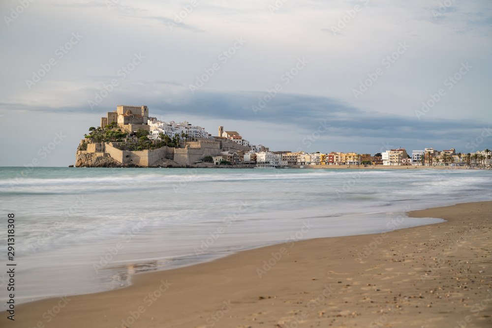 Landscape with beach and view of old town Papa Luna Castle. Peniscola, Spain