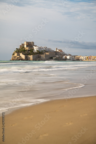 Landscape with beach and view of old town Papa Luna Castle. Peniscola, Spain