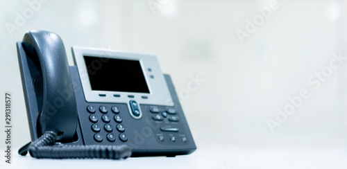 close up telephone landline on table at operation room in the office for business and technology concept 