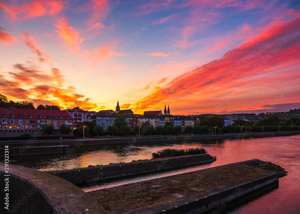 Sunset in the city with castle and river and bridges in Germany