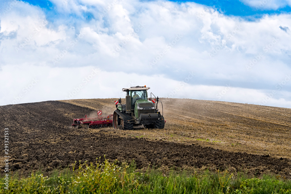 Fototapeta premium farmer in tractor