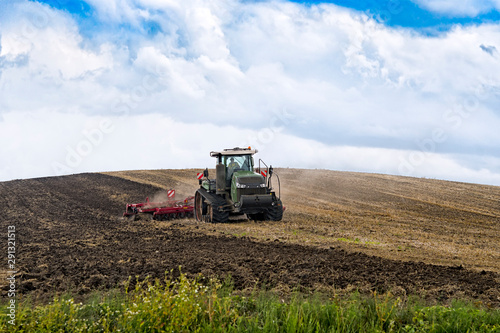 farmer in tractor © Perytskyy