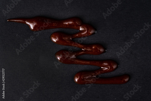 bbq sauce on the black background