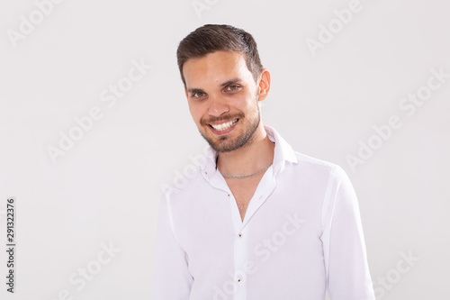 Happy young casual man portrait isolated on white background © satura_