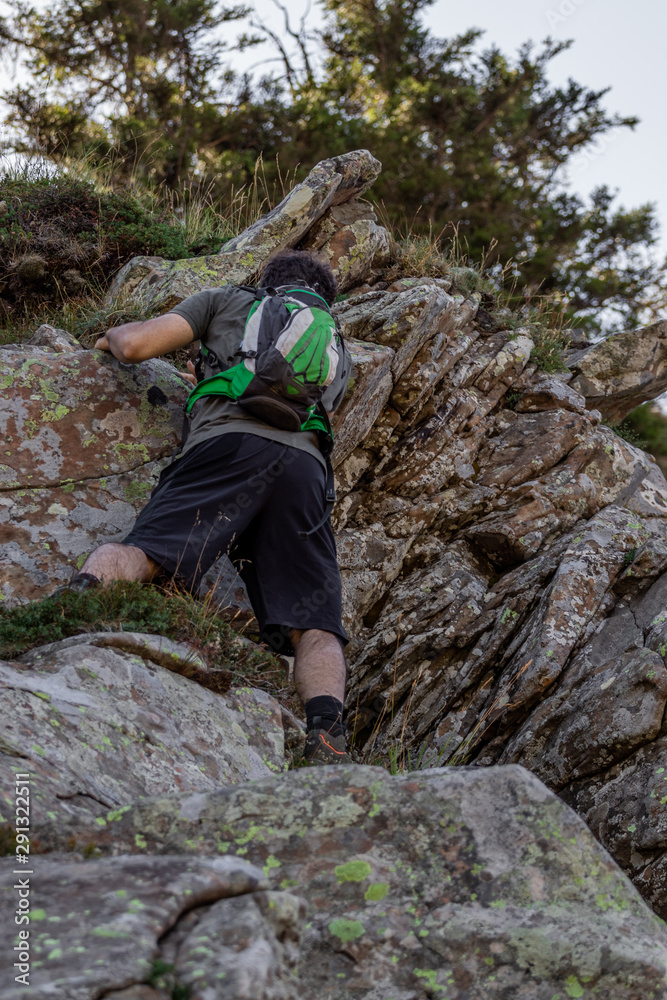 Climbing rock alongside the trail