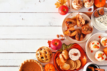 Autumn food corner border. Table scene with a selection of pies, appetizers and desserts. Top view over a white wood background. Copy space.