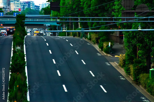 A downtown street at Kanpachi avenue in Tokyo daytime long shot photo