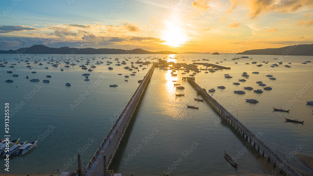 Fototapeta premium aerial photography at Chalong pier. Chalong bay is the most important marina of Phuket there have 2 piers and customs at pier.. Chalong pier transport tourist to travel around islands in Andaman sea
