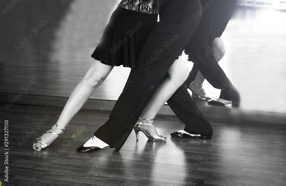 Male and female legs dancing latin rhythms and swing