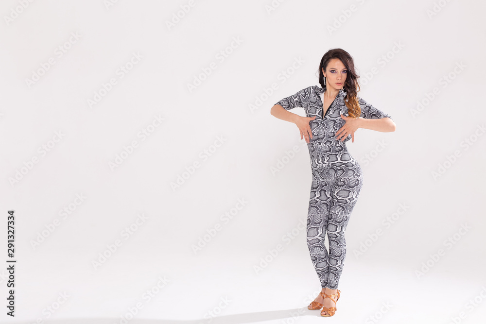 Latina dance, strip dance, contemporary and bachata lady concept - Woman dancing improvisation and moving her long hair on a white background Latina dance, strip dance, contemporary and bachata lady concept - Woman dancing improvisation and moving her long hair on a white background