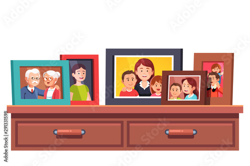 Family relatives photos frames on chest of drawers