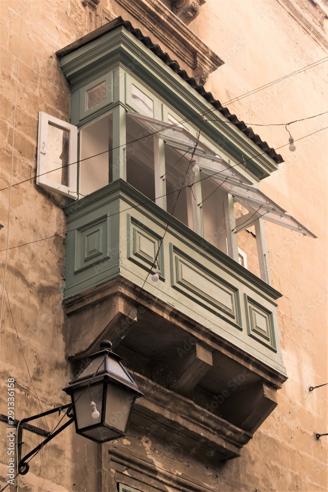 Valletta, Malta, August 2019. A typical Maltese balcony on an old building.