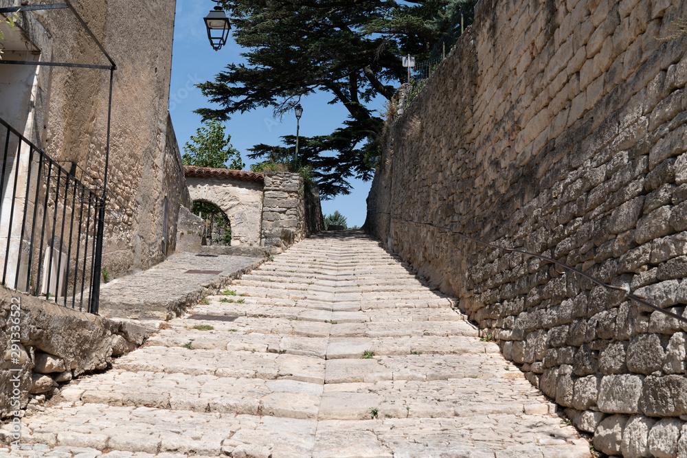 stones stairs in alley village of Bonnieux in Luberon France South