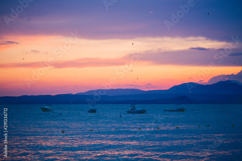 Beautiful evening  sunset overlooking Lake Garda  Alps  mountains. After the rain