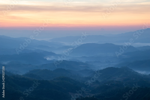mountains valley with the sea of fog and clouds.Layers of mountains in morning sunrise. © MemoryMan