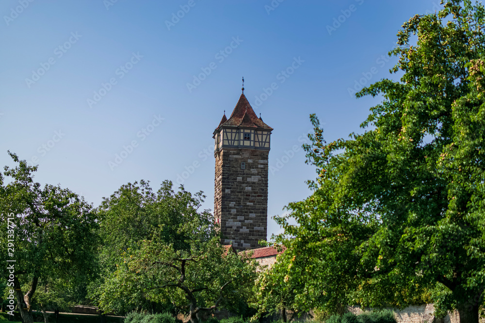Tower on top of the wall of a romantic town. Photograph taken in Rothenburg ob der Tauber, Bavaria, Germany.