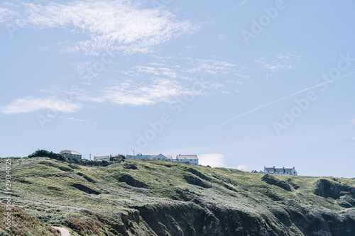 Amazing view of white houses on the cliffs of Rhossili Bay, photo