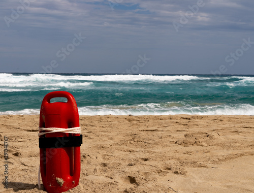 Red baywatch buoy at beach