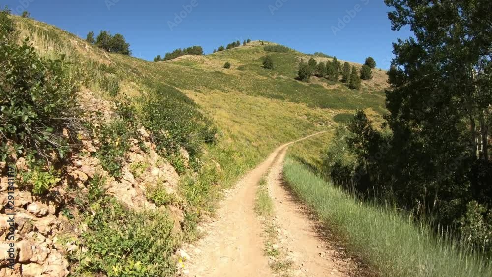 Beauty exploring high mountain roads and trails. 4x4 4 wheel drive ATV high ridge and valley. Outdoors and landscape. Forest alpine rocky peaks. Beauty exploring high mountain roads and trails. 4x4 4 wheel drive ATV high ridge and valley. Outdoors and landscape. Forest alpine rocky peaks.