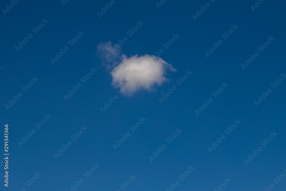 Single cumulus cloud on blue sky on a sunny day. Single cumulus cloud on blue sky on a sunny day.