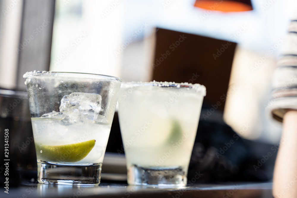 Close up of two margarita cocktail in glasses. Close up of two margarita cocktail in glasses.