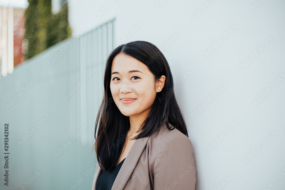 Confidently smiling asian business woman