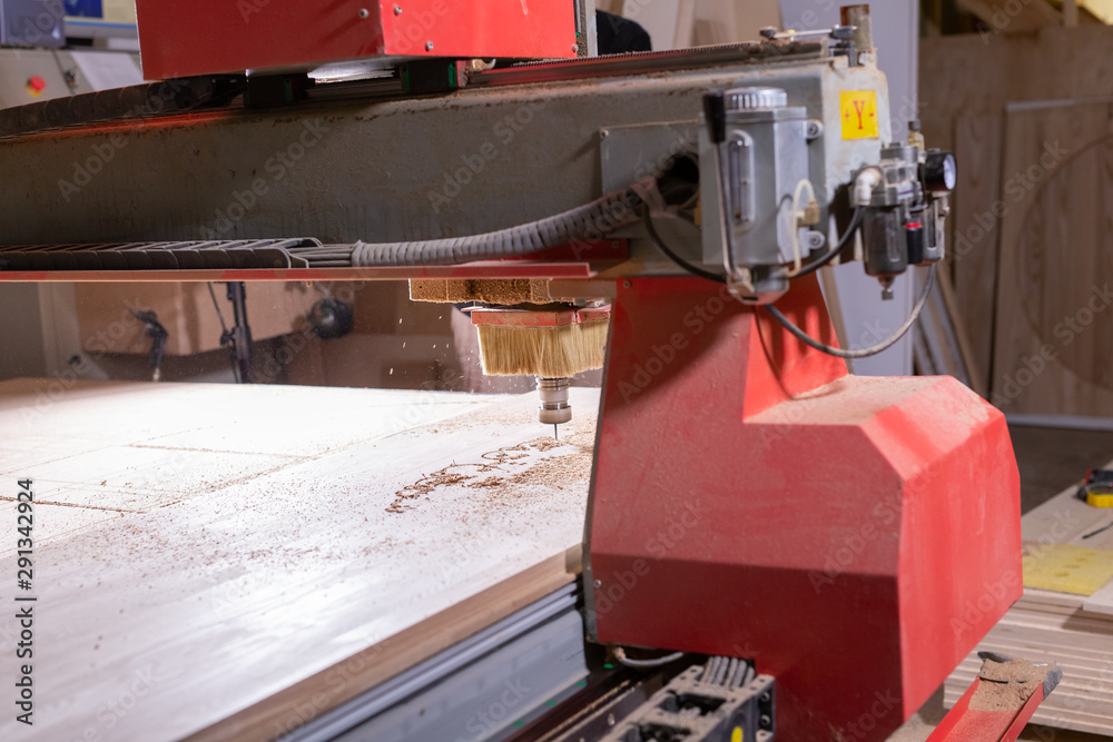 wood, metal, production concept - the cutting instrument, focus at the cutting process wood, metal, production concept - the cutting instrument, focus at the cutting process