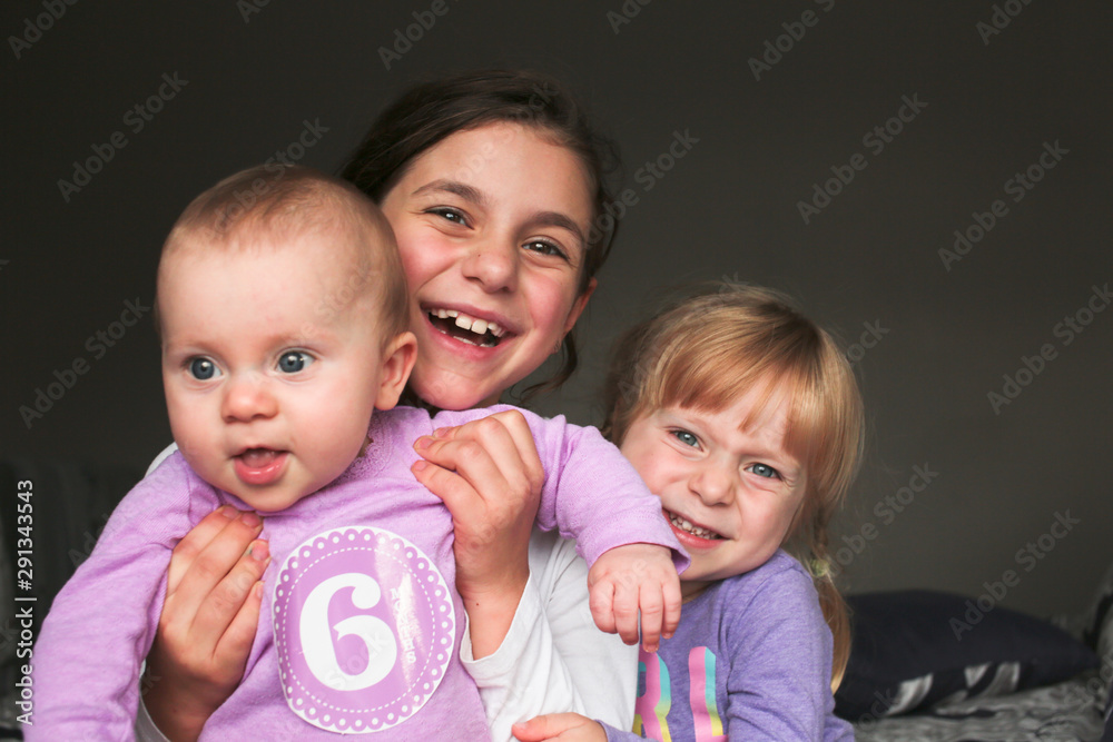 Close up Portrait of Three Beautiful Sisters, One Cute Toddler Girl , 6 Month Old Baby Girl, 7 Years Old Girl, Best Friends Forever, Happy family concept, The most Beautiful Girls, Princesses Close up Portrait of Three Beautiful Sisters, One Cute Toddler Girl , 6 Month Old Baby Girl, 7 Years Old Girl, Best Friends Forever, Happy family concept, The most Beautiful Girls, Princesses