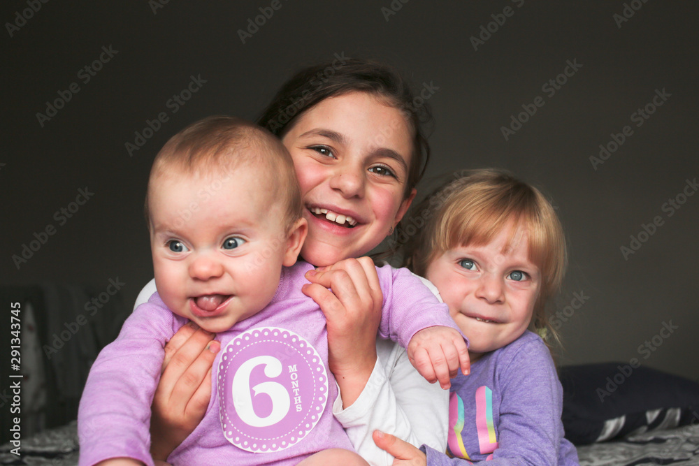 Close up Portrait of Three Beautiful Sisters, One Cute Toddler Girl , 6 Month Old Baby Girl, 7 Years Old Girl, Best Friends Forever, Happy family concept, The most Beautiful Girls, Princesses Close up Portrait of Three Beautiful Sisters, One Cute Toddler Girl , 6 Month Old Baby Girl, 7 Years Old Girl, Best Friends Forever, Happy family concept, The most Beautiful Girls, Princesses