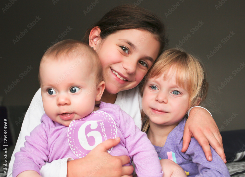 Close up Portrait of Three Beautiful Sisters, One Cute Toddler Girl , 6 Month Old Baby Girl, 7 Years Old Girl, Best Friends Forever, Happy family concept, The most Beautiful Girls, Princesses Close up Portrait of Three Beautiful Sisters, One Cute Toddler Girl , 6 Month Old Baby Girl, 7 Years Old Girl, Best Friends Forever, Happy family concept, The most Beautiful Girls, Princesses