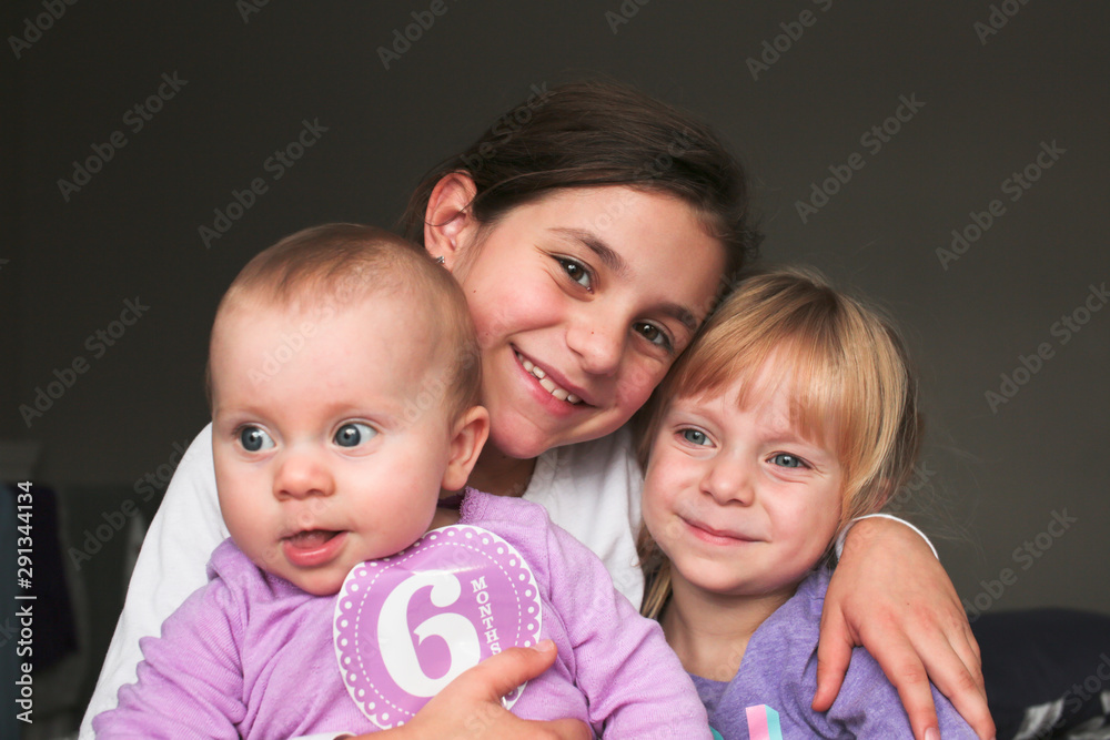 Close up Portrait of Three Beautiful Sisters, One Cute Toddler Girl , 6 Month Old Baby Girl, 7 Years Old Girl, Best Friends Forever, Happy family concept, The most Beautiful Girls, Princesses Close up Portrait of Three Beautiful Sisters, One Cute Toddler Girl , 6 Month Old Baby Girl, 7 Years Old Girl, Best Friends Forever, Happy family concept, The most Beautiful Girls, Princesses