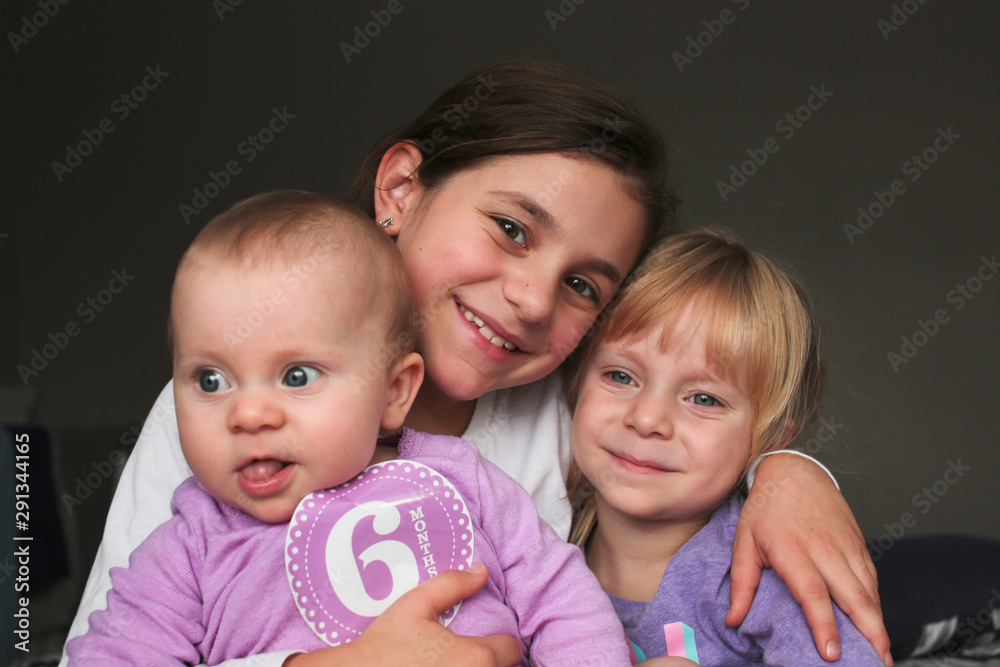 Close up Portrait of Three Beautiful Sisters, One Cute Toddler Girl , 6 Month Old Baby Girl, 7 Years Old Girl, Best Friends Forever, Happy family concept, The most Beautiful Girls, Princesses Close up Portrait of Three Beautiful Sisters, One Cute Toddler Girl , 6 Month Old Baby Girl, 7 Years Old Girl, Best Friends Forever, Happy family concept, The most Beautiful Girls, Princesses